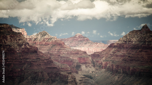 Grand Canyon on a cloudy day, high contrast landscape with clouds and sky, rays of sunlight