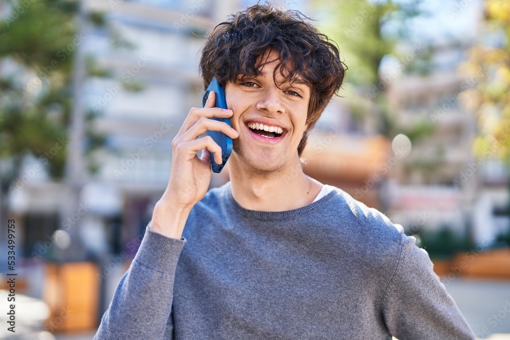 Young hispanic man smiling confident talking on the smartphone at park Young hispanic man smiling confident talking on the smartphone at park