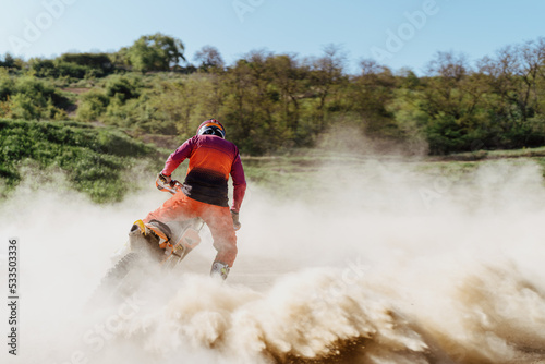 Extreme and Adrenaline. Motocross rider in action. Motocross sport. Active lifestyle. Flying dust.