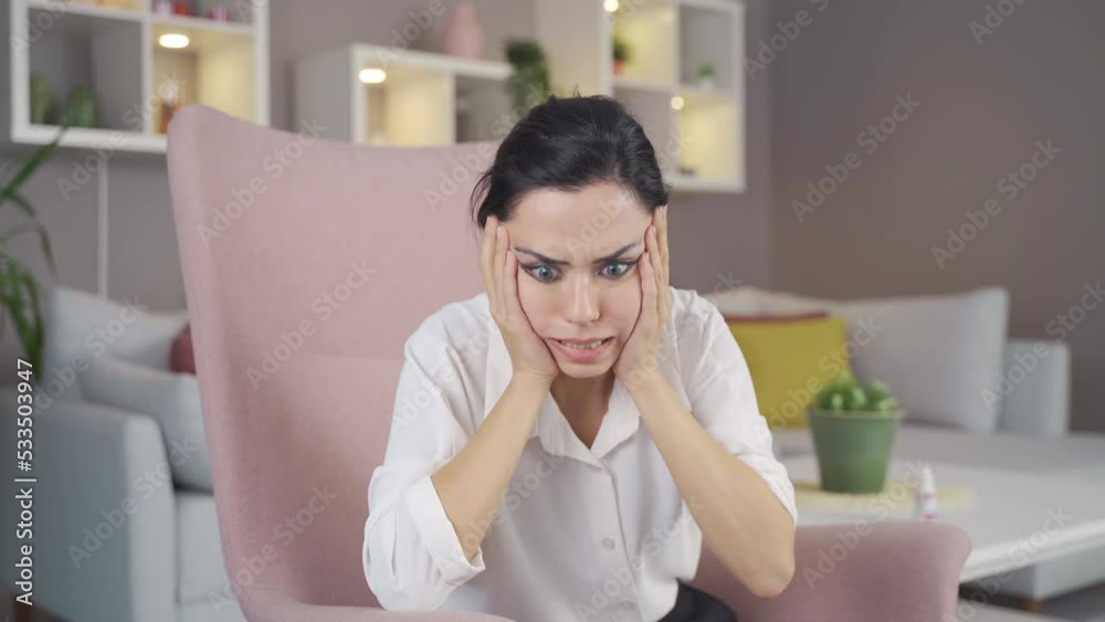 Depressed woman is scared and screams.
Woman at home scared and screaming and looking around.
Depressed woman is scared and screams.
Woman at home scared and screaming and looking around.