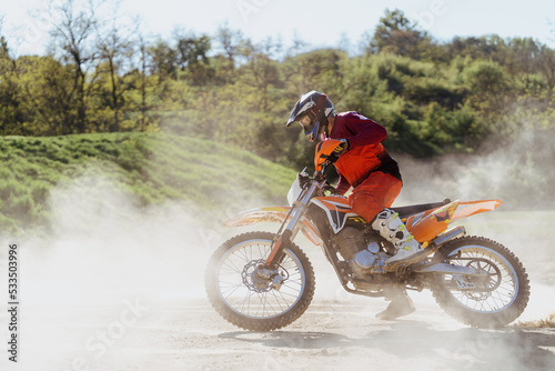 Extreme and Adrenaline. Motocross rider in action. Motocross sport. Active lifestyle. Flying dust.