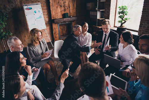 Portrait of businesspeople attending event discussing plan growth finance at loft wood brick industrial style interior indoors