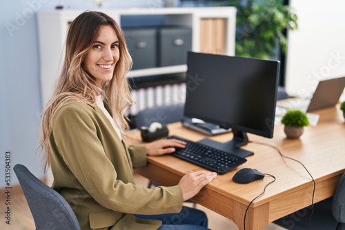 Young woman business worker using computer working at office