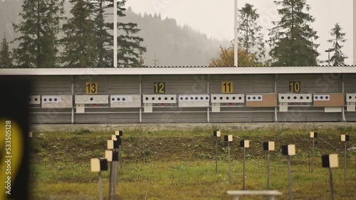 The biathlon shooting range is being prepared for the winter season. Firing line for sports competitions in the rain. Targets for biathlon photo