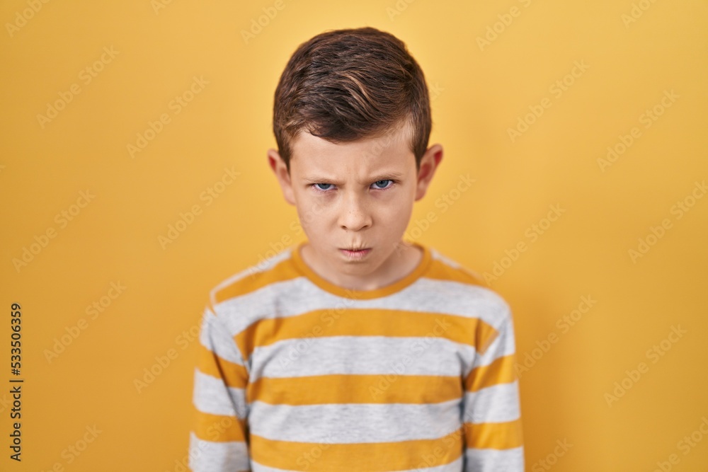 custom made wallpaper toronto digitalYoung caucasian kid standing over yellow background skeptic and nervous, frowning upset because of problem. negative person.
