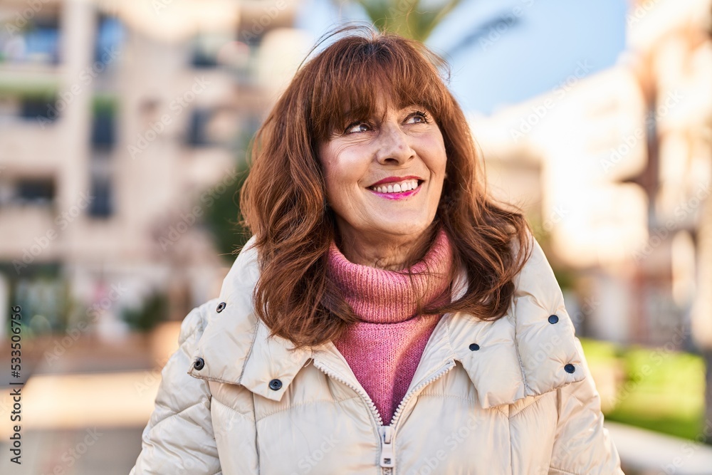 Middle age woman smiling confident standing at street Middle age woman smiling confident standing at street