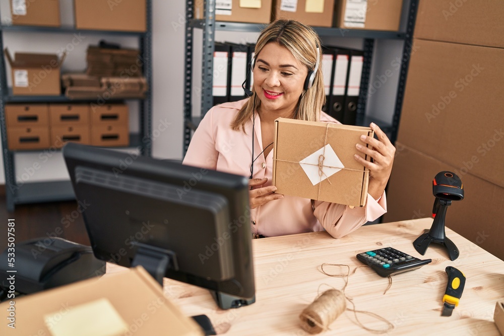 Young hispanic woman ecommerce business worker having video call at office Young hispanic woman ecommerce business worker having video call at office