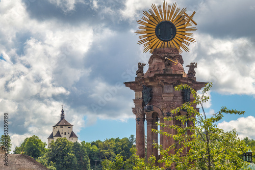 Plague column with The New castle in Banska Stiavnica, Slovakia, Europe. photo