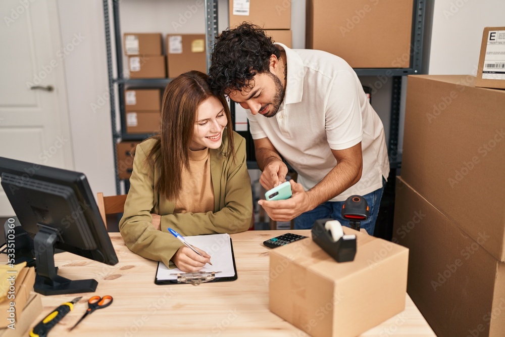 Man and woman business workers using smartphone working at office Man and woman business workers using smartphone working at office