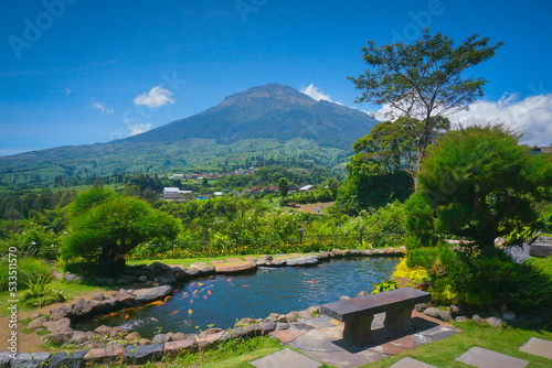 Beautiful landscape view with koi ponds and Sumbing mountain on background. Beautiful park of sigandul view Temanggung Indonesia. 
