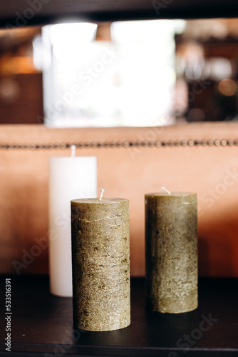 candle on a wooden table