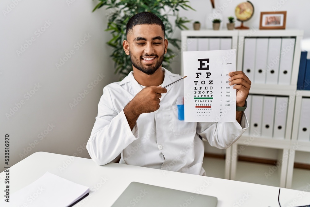 Young arab man holding sneller test at clinic Young arab man holding sneller test at clinic