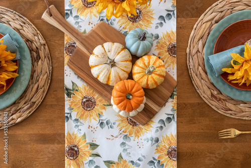 Quadro su tela Top view of pretty fall tablescape with colorful pumpkins