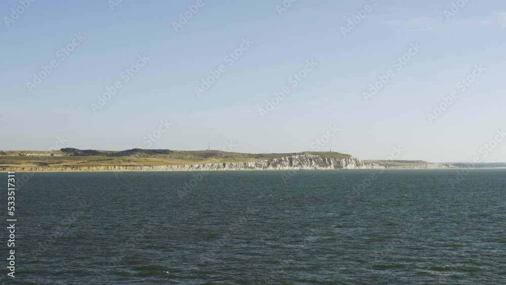 Calais to Dover cross channel ferry leaving dover harbour. Cliffs of Etretat in Normandy, France. Calais to Dover cross channel ferry leaving dover harbour. Cliffs of Etretat in Normandy, France.