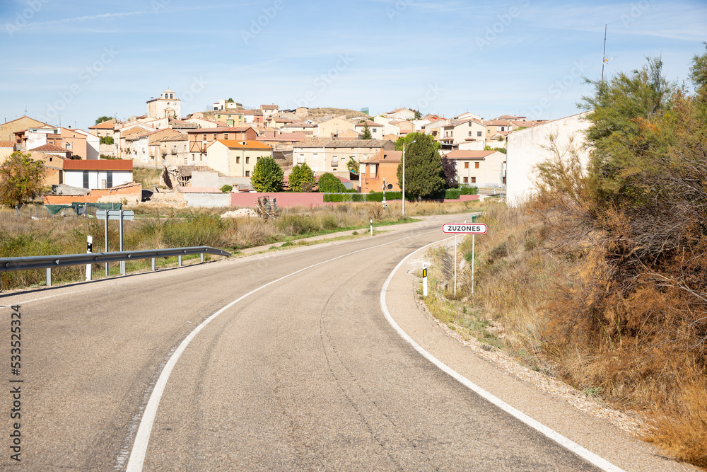 a paved road entering Zuzones village, La Vid y Barrios, Ribera del Duero, province of Burgos, Castile and León, Spain