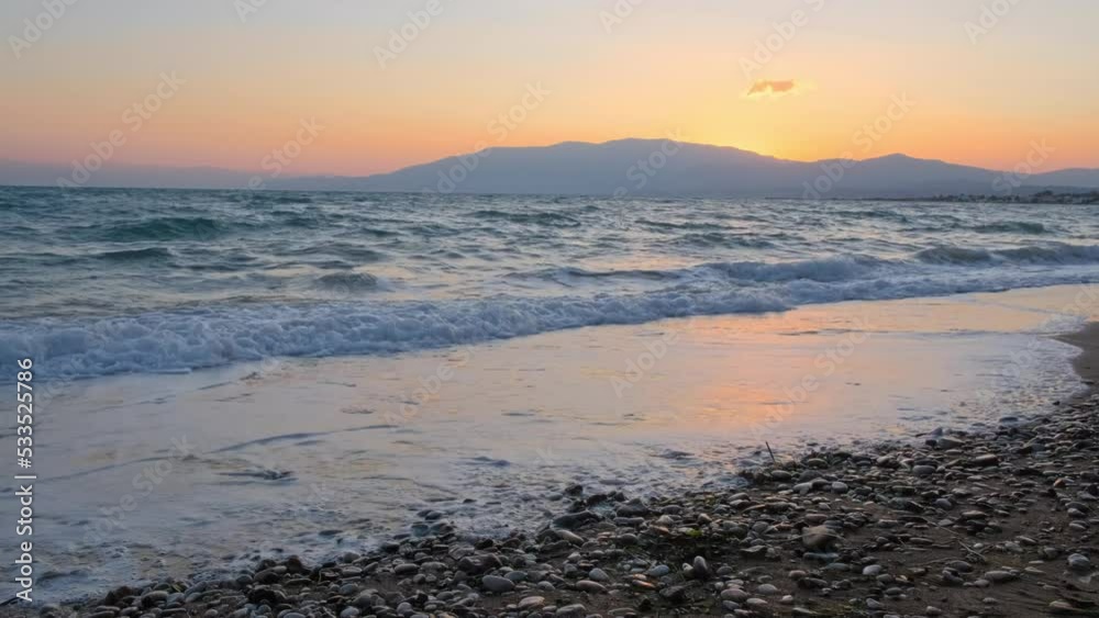 Amazing sunrise over the tropical beach. Yellow sun over sea. Orange colors waves. Nature background. Beautiful serene scene. Morning. Sunlight reflect on water surface Amazing sunrise over the tropical beach. Yellow sun over sea. Orange colors waves. Nature background. Beautiful serene scene. Morning. Sunlight reflect on water surface