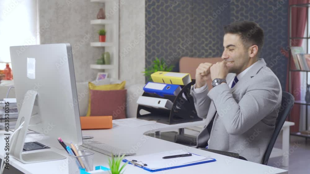 Businessman succeeds and earns in his home office.
Businessman working in home office is working on computer and is happy to see and succeed.
