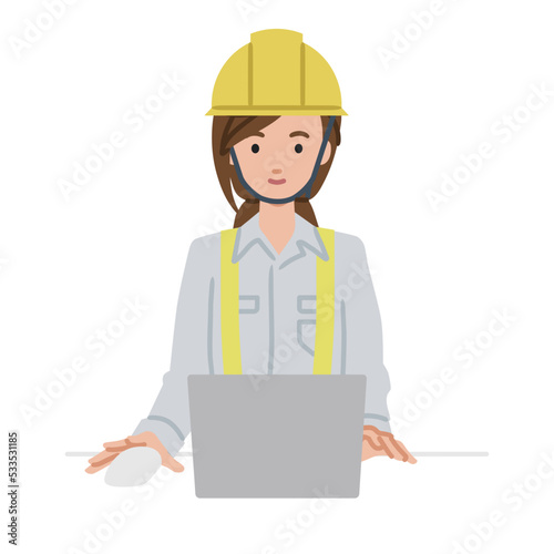 デスクで座ってPCを使っている工事現場の女性