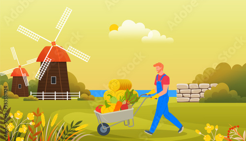 Farmer wearing in overalls and rubber boots pushing wheelbarrow full of vegetables. Agricultural male worker with autumn harvest. Man rancher going with vegetables in cart, harvesting in farm