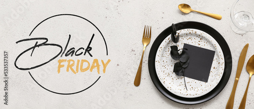 Banner with table setting and text BLACK FRIDAY on light background photo