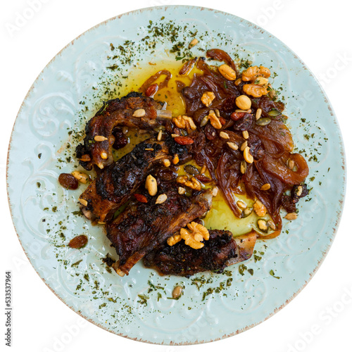 Juicy fried pork chop with golden crust served with sesame and walnut. Isolated over white background