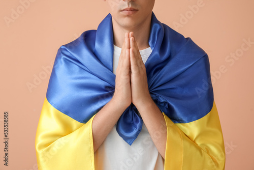 Young man with flag of Ukra...