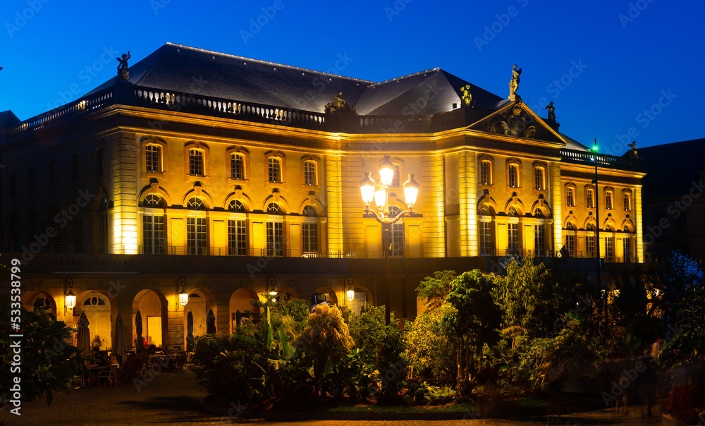 Night view of Place de la Comedie in front of Opera and Theater building illuminated by yellow light in Metz, lorraine, France
