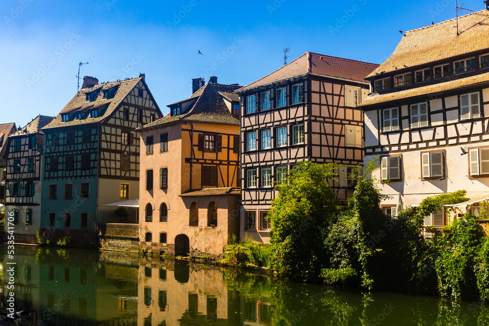 Traditional fachwerk houses on canals district of Strasbourg town in eastern France