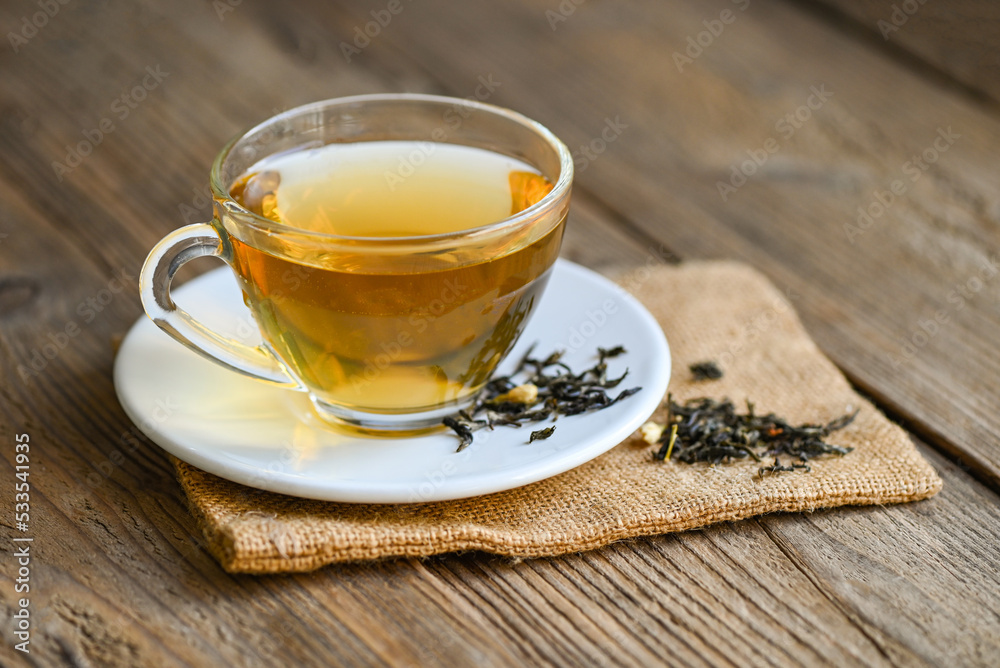 tea herbal on tea cup with chinese dry tea on wooden table tea herbal on tea cup with chinese dry tea on wooden table