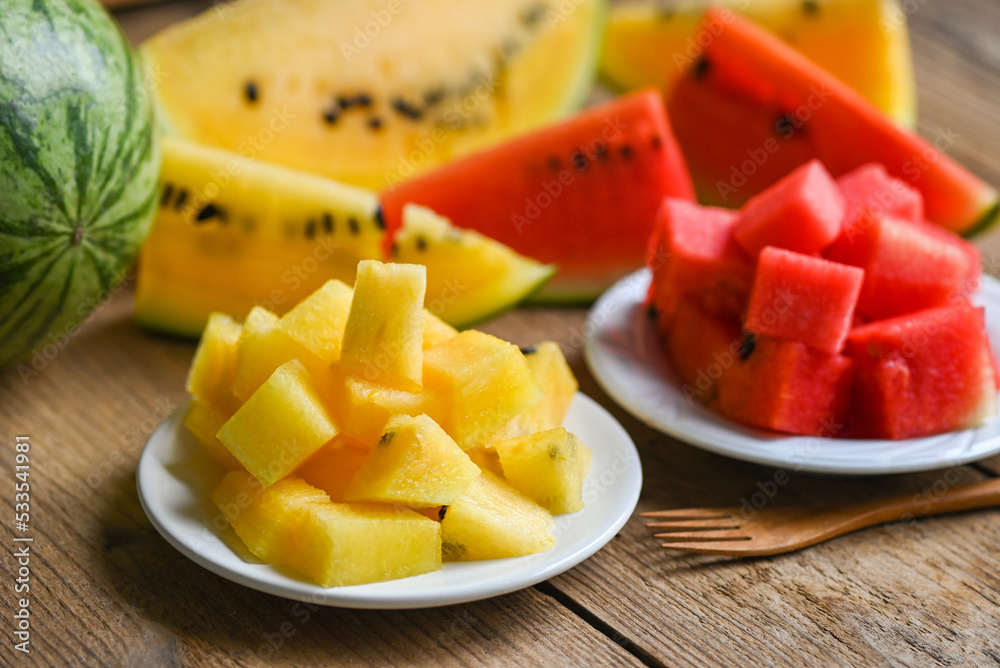 Closeup sweet watermelon slices pieces fresh watermelon tropical summer fruit, Red and yellow watermelon slice on plate and wooden background