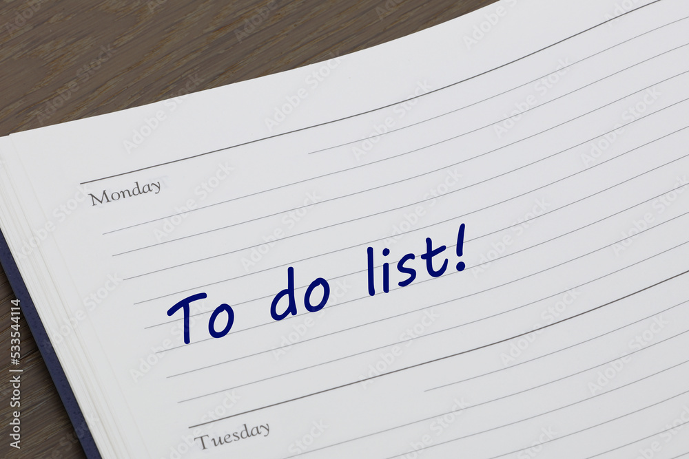 To do list diary reminder open on desk To do list diary reminder open on desk