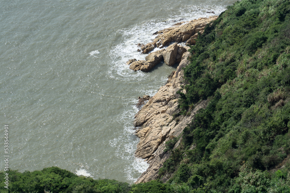 Spindrift and rocks by the sea, photo in Taizhou, Zhejiang.