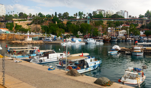 Old town harbor and port of Turkish city Antalya with variety of boats.