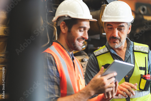 Wallpaper Mural professional technician engineer with safety helmet hard hat working in industrial manufacturing factory, men at work to checking equipment of machinery production technology or construction operating Torontodigital.ca