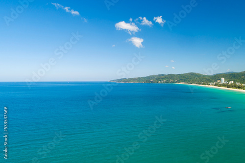 Fototapeta Naklejka Na Ścianę i Meble -  Aerial view of a blue sea surface water texture background,Amazing sea sun reflections, Aerial flying drone view Waves water surface texture on sunny tropical ocean in Phuket island Thailand