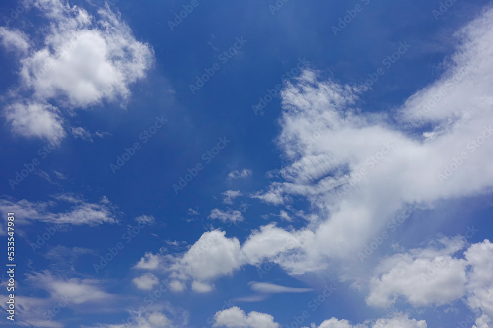 Obraz premium Puffy fluffy white clouds blue sky.