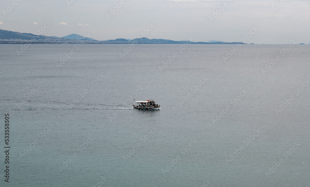 Fishing boat in the sea on a winter day.