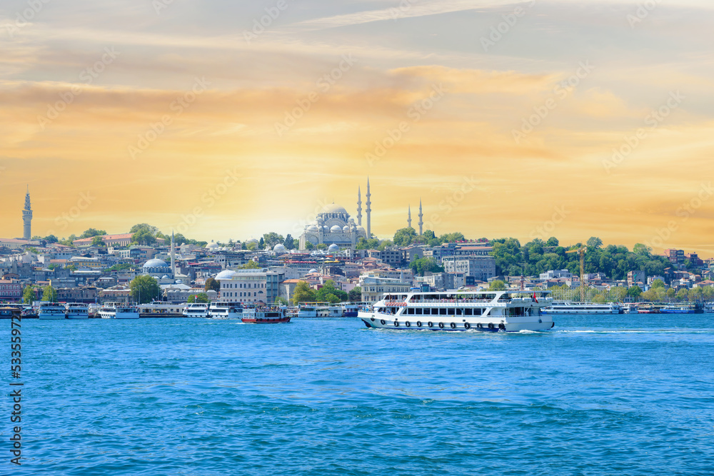 Istanbul city with Suleymaniye Mosque with boats in golden horn