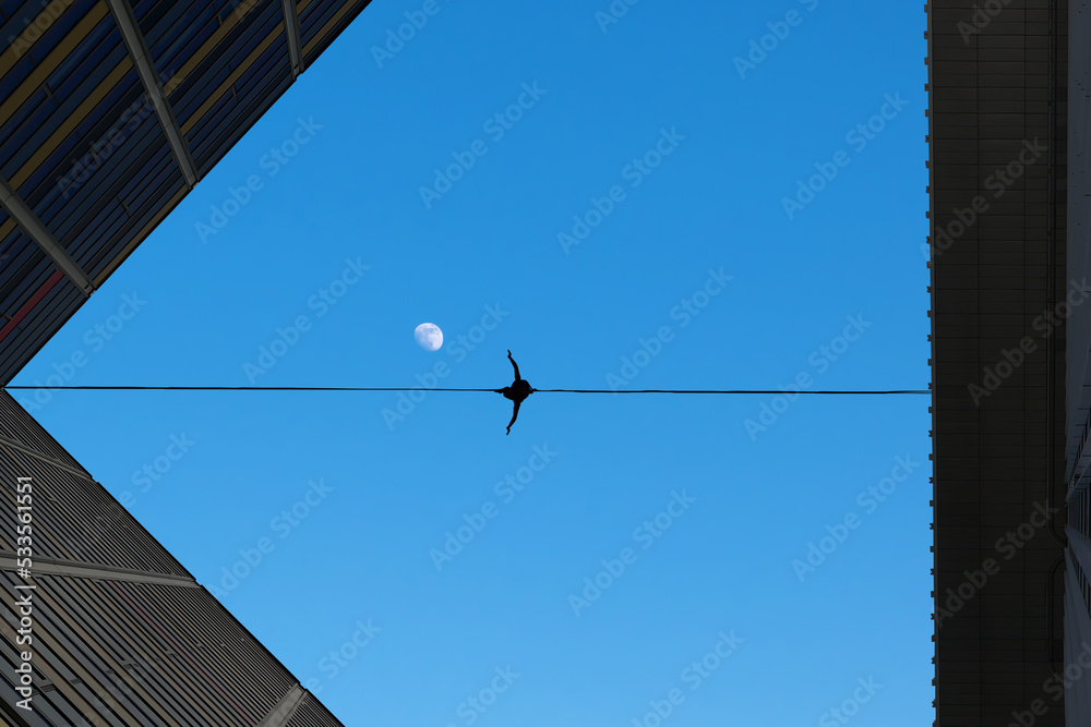 Man balancing on the rope risk taking concept Man balancing on the rope risk taking concept