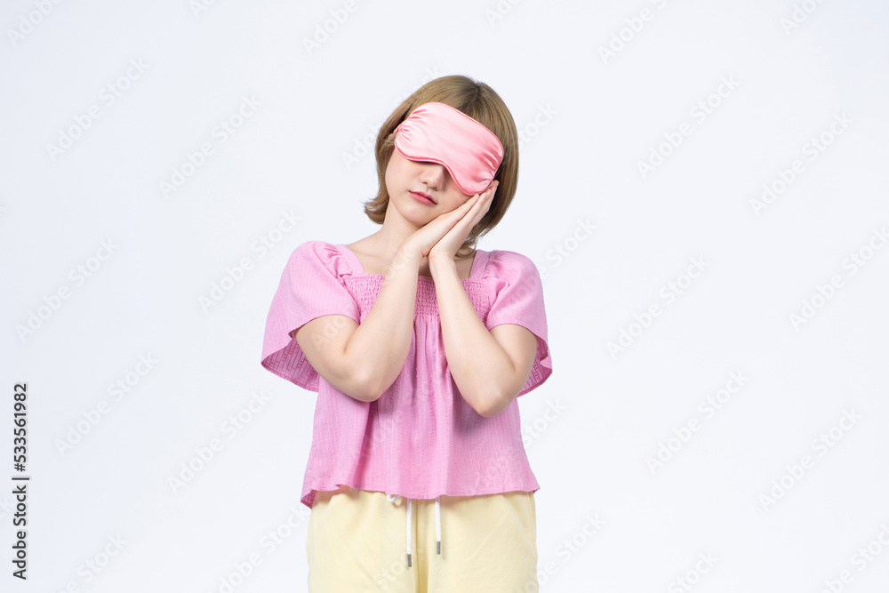 beautiful smiling model wearing a sleep mask on white beautiful smiling model wearing a sleep mask on white