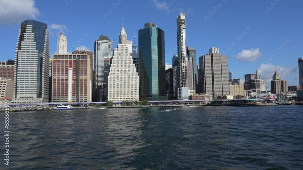 4K video with a beautiful Manhattan skyline view from a boat cruise on East River, travel to New York and visit the landmarks of the city. 4K video with a beautiful Manhattan skyline view from a boat cruise on East River, travel to New York and visit the landmarks of the city.