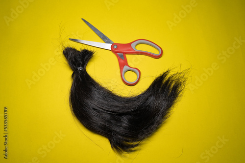 A lock of hair and scissors