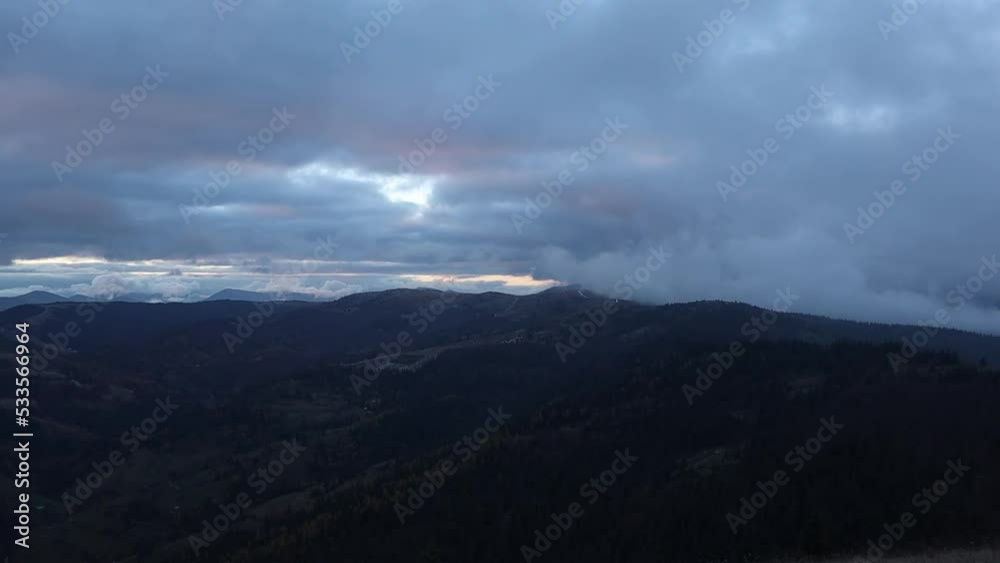 Time-lapse of a beautiful landscape with mountains. A cloudy sky moving above mountains and a long road Time-lapse of a beautiful landscape with mountains. A cloudy sky moving above mountains and a long road