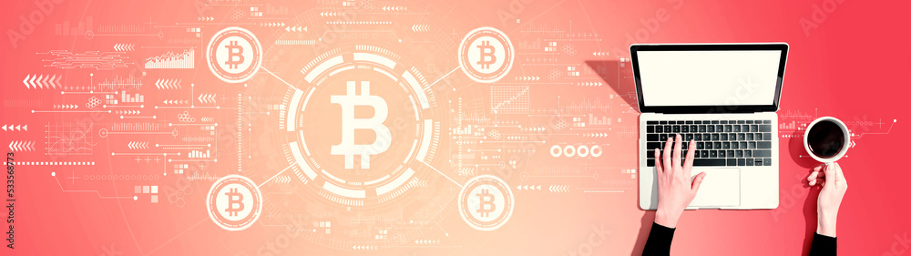 Bitcoin theme with person using a laptop computer Bitcoin theme with person using a laptop computer