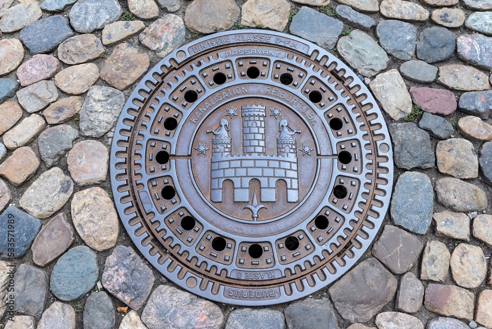 Round manhole cover, Freiburg im Breisgau, Baden-Wuerttemberg, Germany, Europe