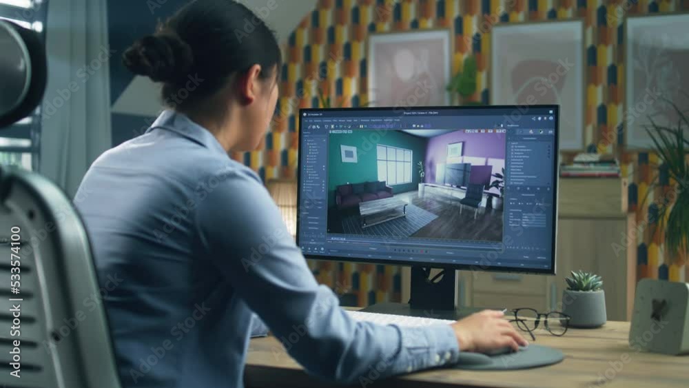 Female designer working remotely from home office and making 3D visualization of house interior in computer program using pc