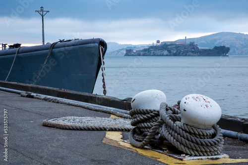 Photography Alcatraz across San Francisco Bay from San Francisco past vessel bow