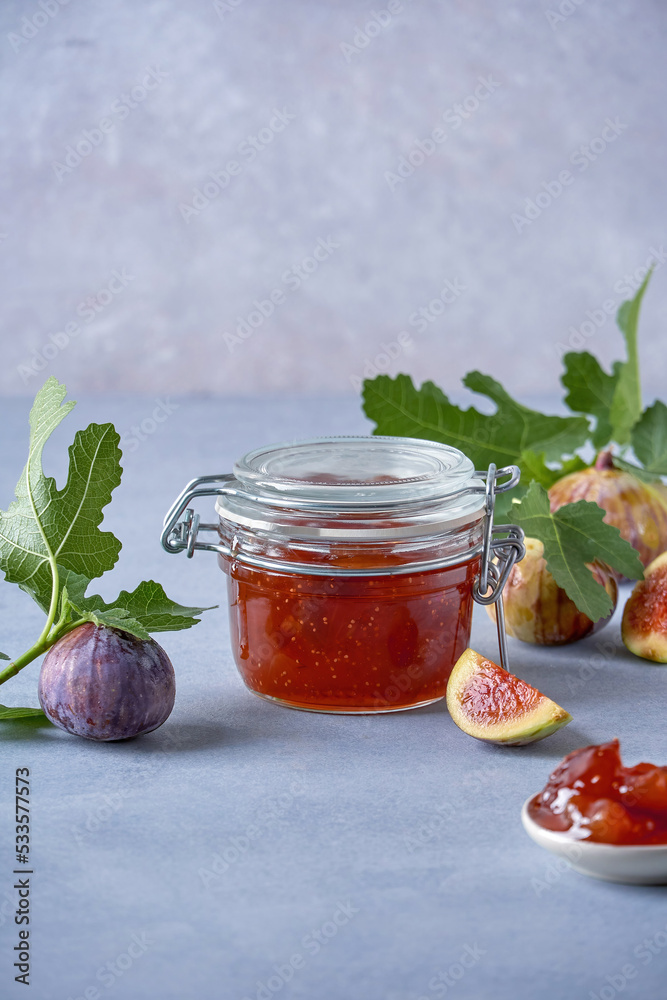 Fig jam in a glass jar and bowl. Fruits preserve Fig jam in a glass jar and bowl. Fruits preserve