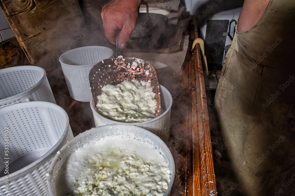 Fototapeta premium Typical copper perforated shed with fresh genuine cottage cheese