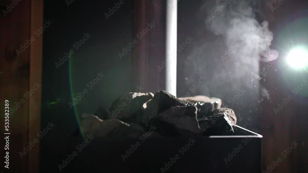 Steam coming off hot rocks in sauna